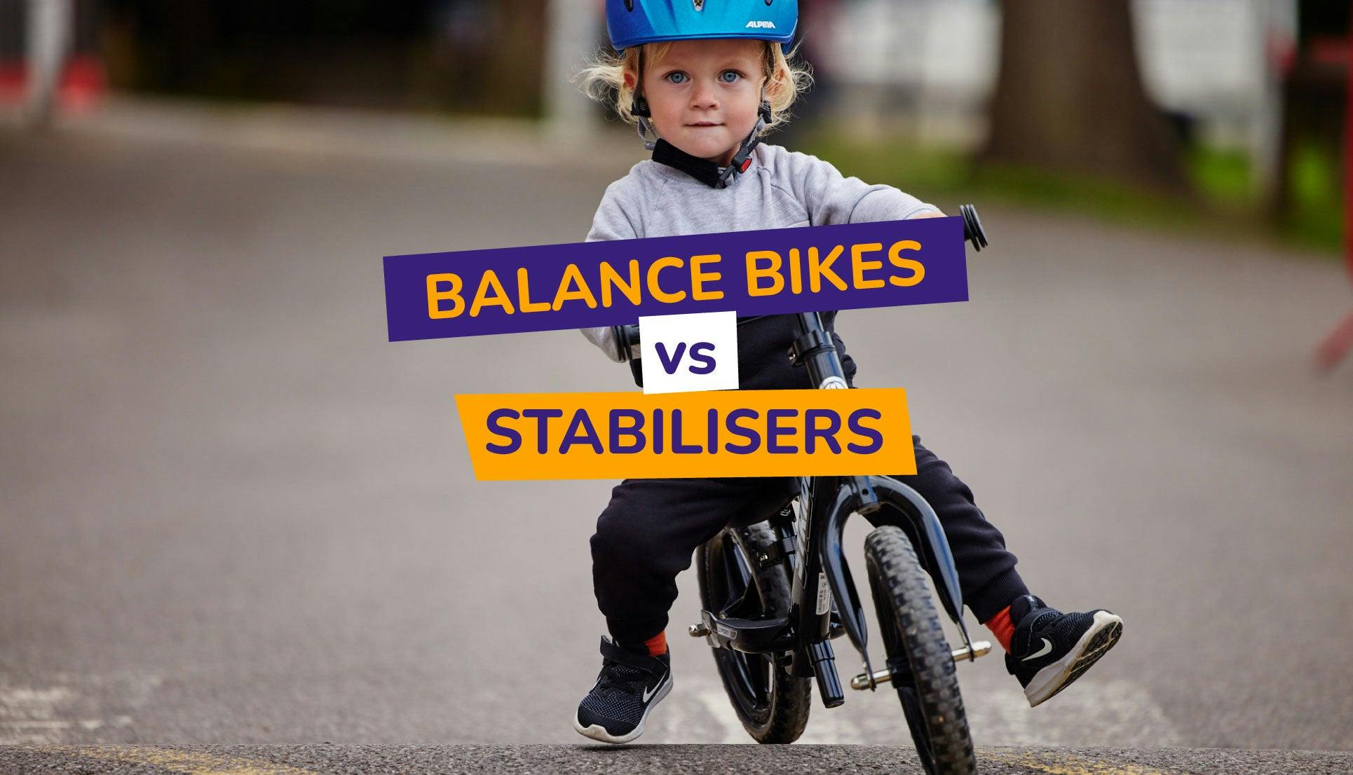 a child wearing a helmet happily riding his strider balance bike
