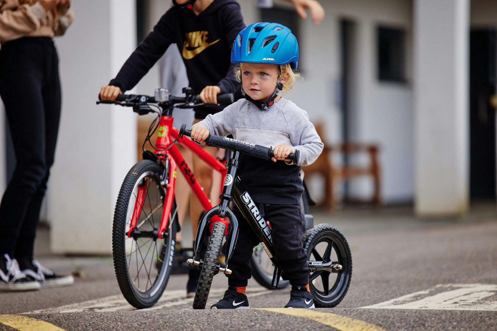 child with a balance bike
