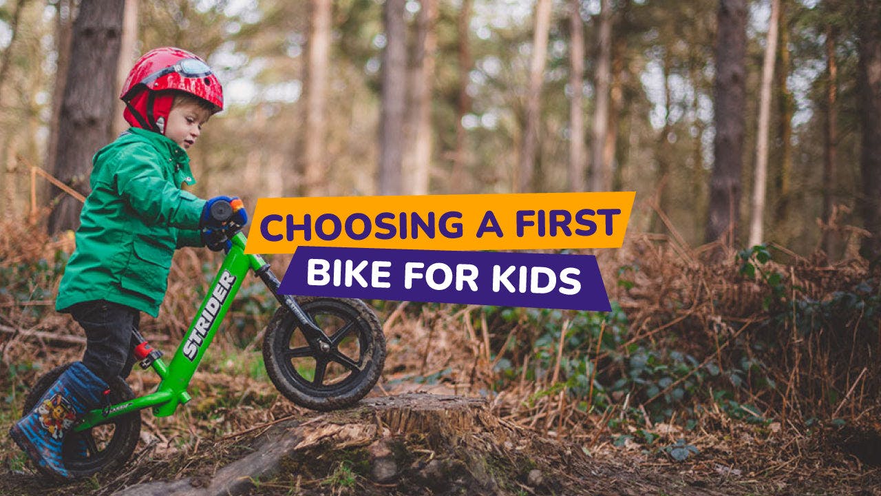 child riding a balance bike in a forest - bike club